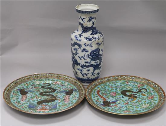 A pair of Canton dragon and phoenix-decorated plates and a 19th century blue and white vase (3)
